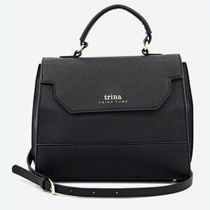 Sleek Sophisticated Trina Turk Black Handbag or Crossbody with Gold Hardware